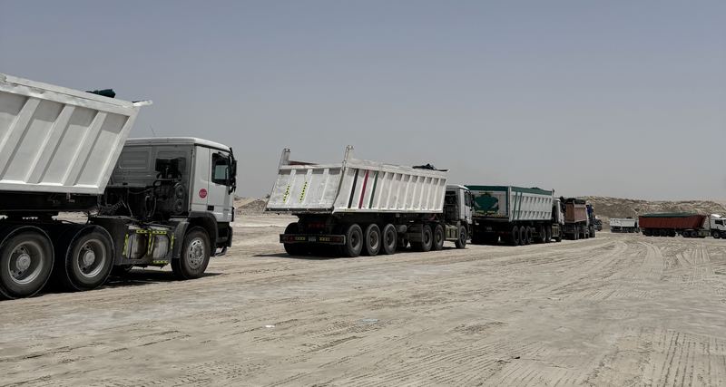 Tipper trucks queued on site waiting to load
